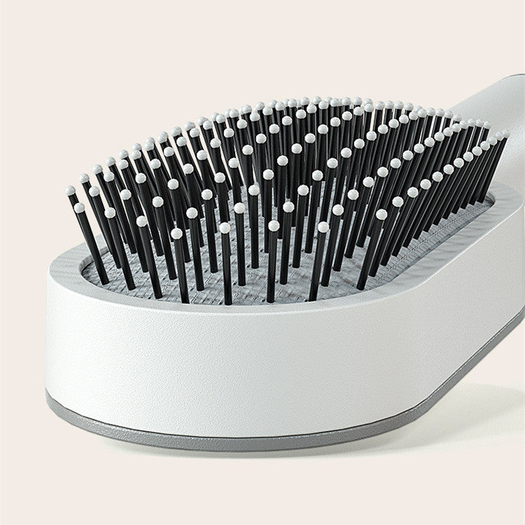 Self-cleaning hair brush for women